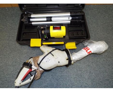 A Performance Power 500W multi - function saw and a surveyors measure with tripod stand and cased (2)