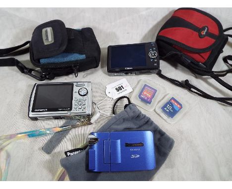 A Panasonic SV-AV10 video camera, an Olympus M850SW shock and waterproof digital camera with protective case and a Canon 1XUX