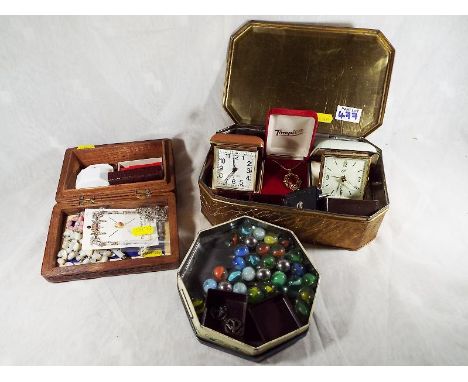 A of costume jewelry to include a small quantity if silver 925, travels clock, vintage marbles, vintage tins and similar (3)