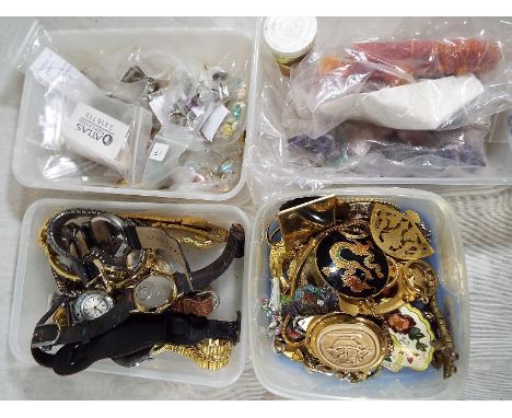 A quantity of costume jewellery to include watches by Timex, Acqur, Sekonda, paired earrings, brooches, enamelled pendants an