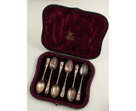 A cased set of six silver and enamel coffee spoons, decorate with different flowers, London 1887