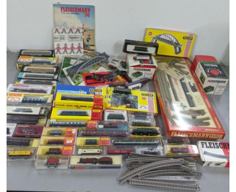 A collection of N-gauge trains and track to include Hornby Minitrix, Fleischmann, Wrenn, Lima engines and rolling stock Locat