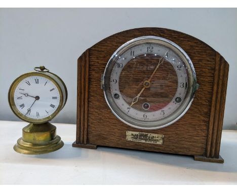 A 1940s oak 8-day mantel clock, together with a brass cased 8-day desk clock having Breguet style hands and dead beat escapem