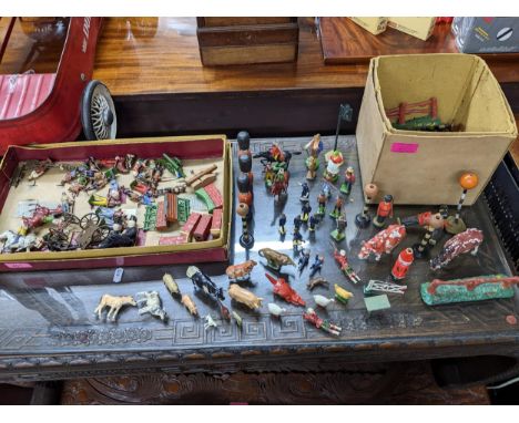 A selection of hollow lead cast, plastic and painted wooden toys to include a miniature scale models Fire Brigade set no.46, 