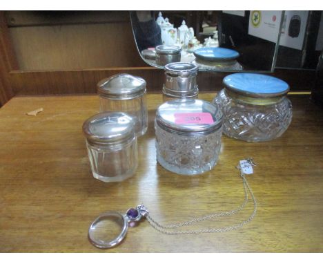 A group of glass and silver topped dressing table bottles, and a 925 silver pendant magnifying glass, the owl finial set with