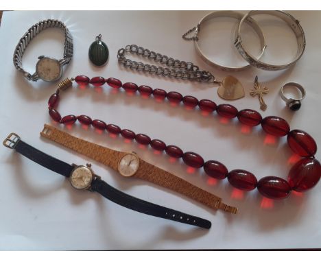 A small quantity of silver jewellery and watches to include 2 engraved silver bangles and a ladies Tissot gold tone cocktail 