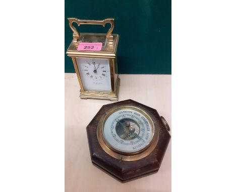 A Taylor & Bligh 5 window carriage clock together with an oak cased German barometerLocation: 