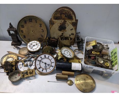 A selection of clock parts to include longcase clock dials, movements, dials, weights and other itemsLocation: 