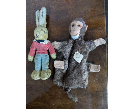 A Chad Valley Hygenic Toys rabbit with pink nose, amber glass eyes and velvet stitched red jacket and blue trousers, label to