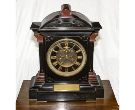 A Victorian slate mantle clock with front escapement dated 1875