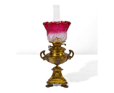 Victorian brass oil lamp with cracked shade