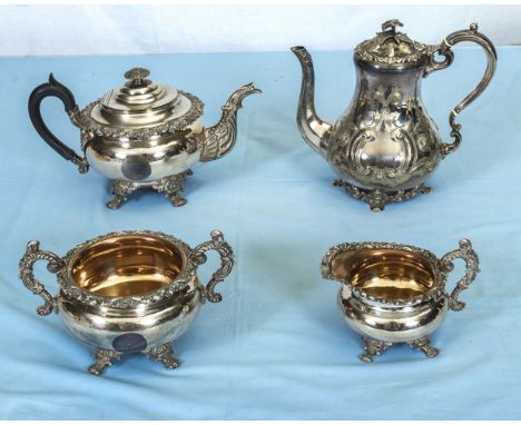 A three piece silver plated tea service and a coffee pot