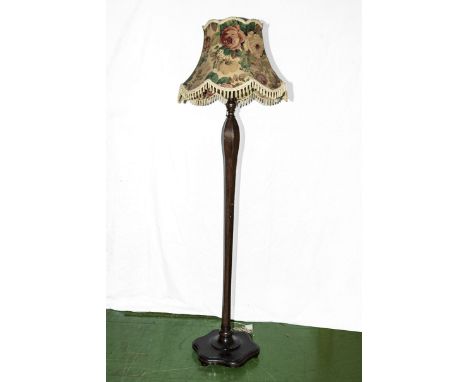 A standard lamp and shade