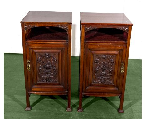 A nice pair of Edwardian mahogany bedside cabinets with carved panel doors