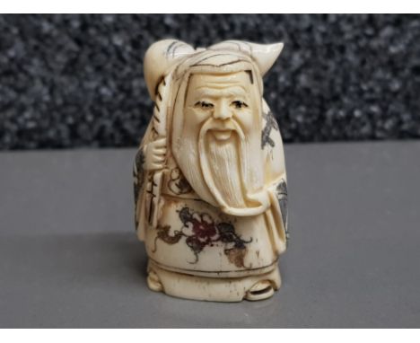 Hand carved bone netsuke, carved as an elder with staff