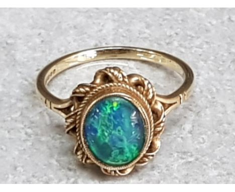 A 9ct yellow gold and opal triplet ring size P 3.1g gross.