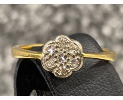 Ladies 18ct gold diamond cluster ring. Comprising of 7 round brilliant cut diamonds set in white gold. 3.7g size L1/2