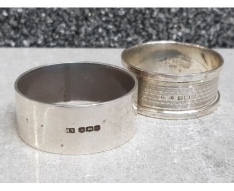 Plain napkin ring etched with initials EMW hallmarked Birmingham 1917 32.2g, together with engine turned ring hallmarked Birm