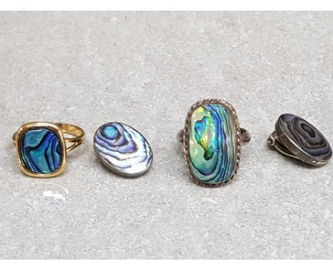 A silver and paua ring size L 1/2 and earrings, together with another paua ring.