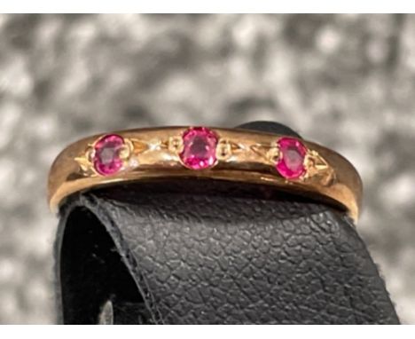 Ladies Rose gold ruby 3 stone ring.