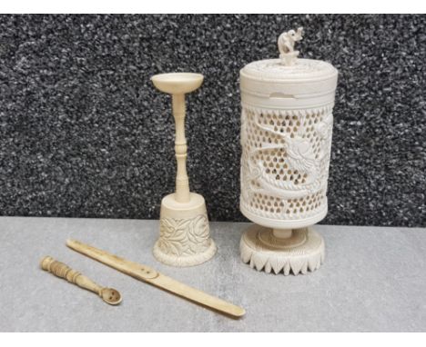 Hand carved and turned pierced lidded round box on fancy integral foot together with turned and carved opium/snuff spoon, tal
