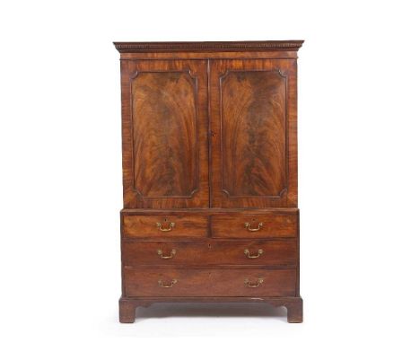 A George III mahogany linen press with panelled doors and standing on bracket feet, 127cm wide x 64cm deep x 189.5cm highCond