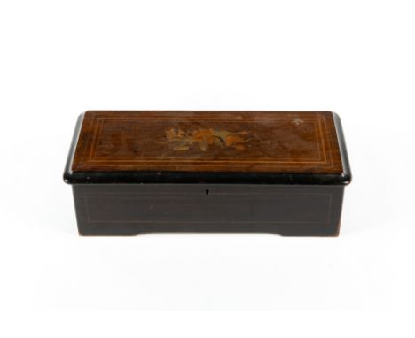 A late 19th century Swiss made cylinder music box with a satinwood inlaid and ebonised case, 43cm wide x 19cm deep x 13cm hig