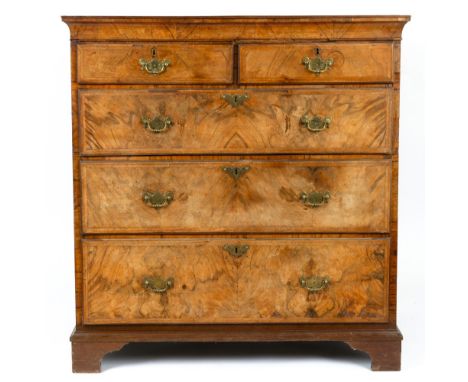 An antique walnut chest of two short and three long drawers with brass handles and bracket feet, 100cm wide x 56cm deep x 105