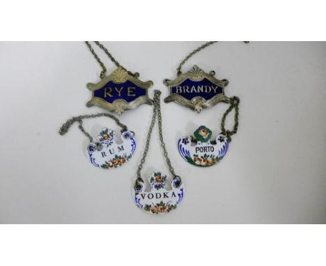 Enamelled decanter labels to include Rum, Porto and Vodka, together with two others in white metal and blue enamel to include