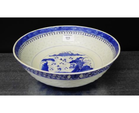 A Chinese blue and white rice grain bowl, painted with a Pagoda scene to the centre on plain foot rim bearing four character 