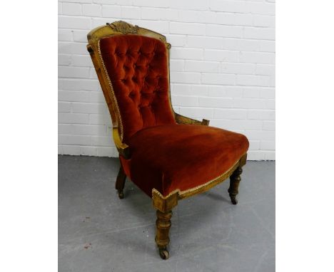 A 19th century mahogany framed button back parlour chair with upholstered seat on turned supports and ceramic castors, 90 x 6