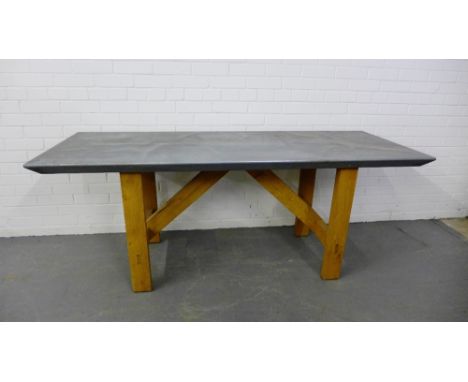 A contemporary table, the rectangular aluminium plated covered top on light oak block supports, 73 x 184cm