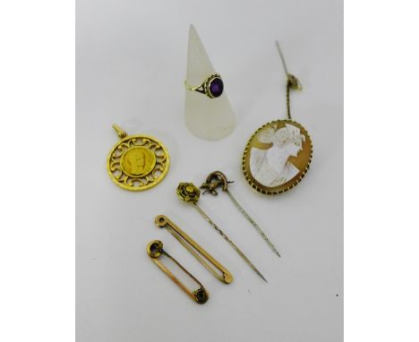 A mixed lot to include a 9ct gold amethyst dress ring, a 9ct gold bar brooch, together with three yellow metal stick pins and