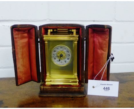 A late 19th century French gilt brass carriage clock, the silvered dial with Arabic numerals and blue steel hands, complete w