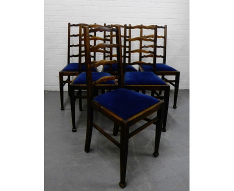 A set of six ladder back chairs with blue upholstered slip in seats, on tapering supports and spade feet (6) 