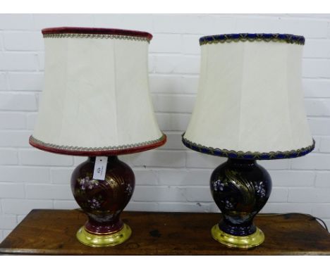 A pair of baluster table lamp bases, one in blue the other in red, each with a chinoiserie pattern, complete with shade (2) 