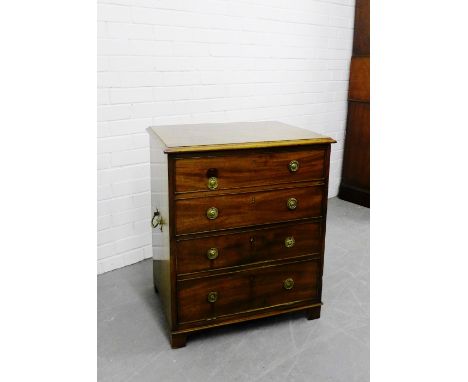 A mahogany commode, the rectangular top with moulded edge with four long graduating dummy drawers to front and brass carry ha