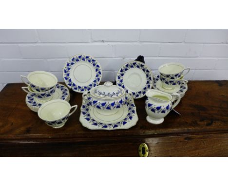 A Royal Doulton Coventry pattern tea set, comprising five cups, six saucers, six side plates, a cake plate, cream jug and twi