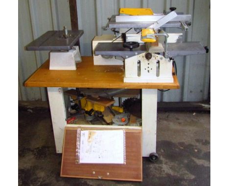 A Kitty 55 Universal wood working machine, complete with saw table extension, spindle moulding cuttings and support roller, 1