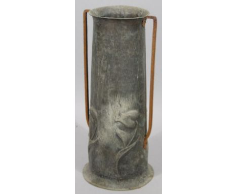 A late 19th/early 20thC Art Nouveau metal stick barrel, of cylindrical tapering form, with angular handles, the main body rai