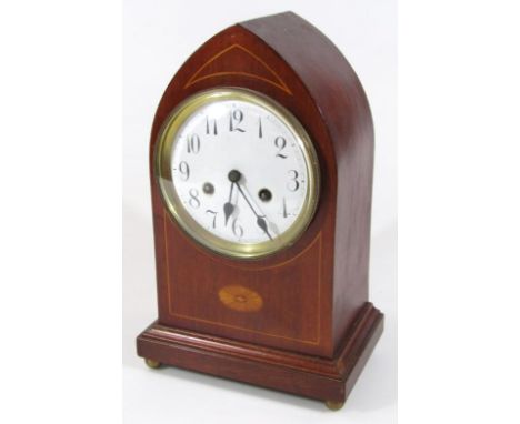 An Edwardian mahogany and boxwood strung domed case mantel clock, with Arabic dial and key wind movement.