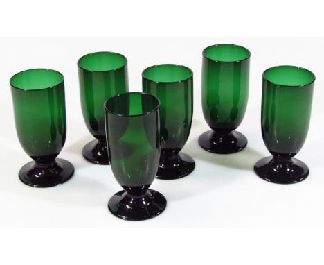 A set of six green glass wine goblets, each with plain bowls on circular feet with rough pontil marks, probably late 19thC, 1