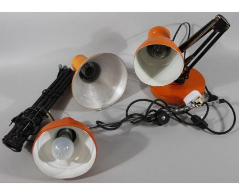 A mid 20thC Bauhaus design angle poise lamp, with orange shade and black metal stem, (when closed), 40cm high, and two others