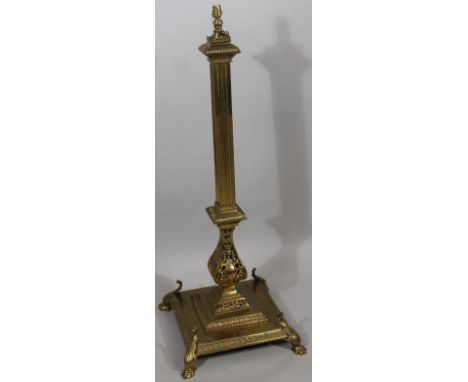 A 19thC heavy brass telescopic floor standing standard lamp, with square column, part pierced lower stem and stepped base ter