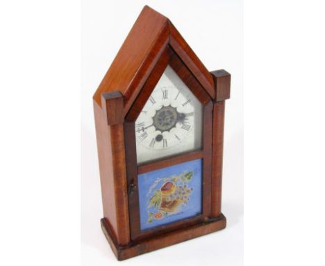 A late 19thC cased mantel clock, with angular top, 12cm dia. dial and glazed front door revealing a key wind movement, 39cm h
