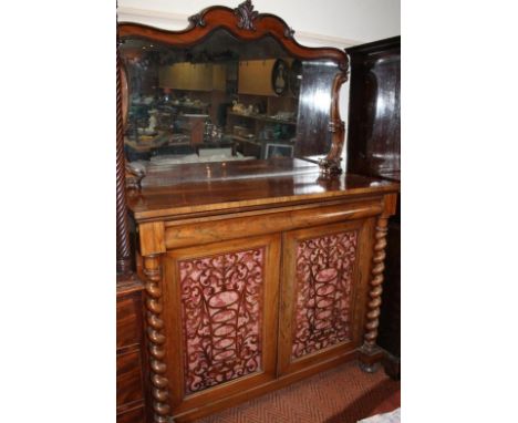 A Victorian rosewood mirror back chiffonier, the carved back raised above two frieze cushion drawers and a pair of fret work 