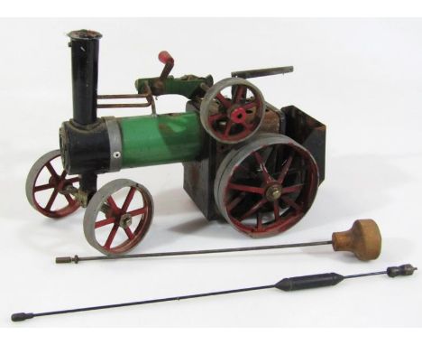 A mid 20thC part built Mamod steam tractor, with articulated wheels and a small quantity of other accessories, 20cm high. (AF