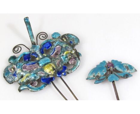 An early 20thC enamel stick pin, headed by an elaborate butterfly in turquoise and purple, the centre picked out in blue, on 