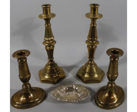 A silver pin dish, of part pierced oval outline, 12cm wide, two ecclesiastical design brass candlesticks of shaped form and t