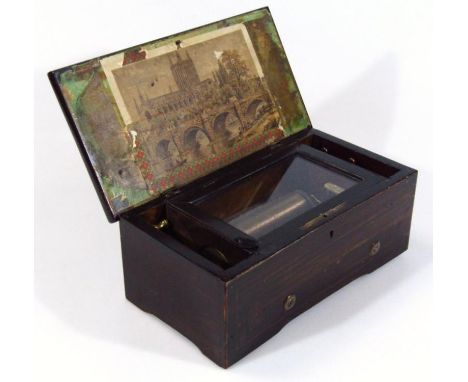 A 19thC cylinder music box, of small proportion, in rectangular cabinet, the hinged lid with bridge and church panel interior